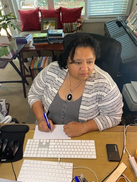 Birgit Burton works at her desk. 